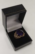 An amethyst ring, stamped '9CT', weight 9.8g One colourless stone lacking