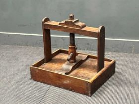 A 19th century oak table top book/ flower press with turned thread screw 51 x 58 x 46cm