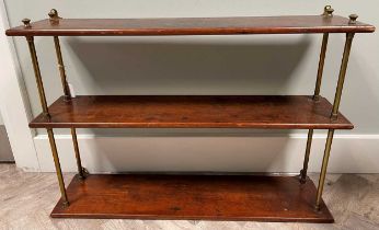 A 19th century set of mahogany hanging shelves with brass column supports, 57 x 81 x 20cm; and a