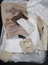A box of various textiles: cross stitch samples; lacework; etc (qty)