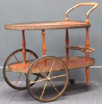Mid 20th century two tier drinks trolley with brass gallery. 76cms H x 72cm W x 43cm D