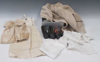 Textile collection of dolls and baby clothes, to include: lace, bonnets, dresses, petticoats and