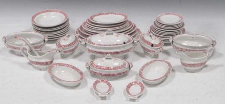 A late 19th century Staffordshire earthenware doll's house dinner service with red greek key borders
