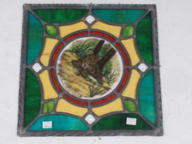 A leaded stained glass panel with central tiger motif, monogrammed 'MY' and dated '04, 35 x 35cm