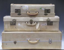 A graduated pair white hide suitcases. The larger of the two measures 17cm H x 76cm W x 41cm D (3 in