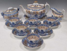 A Miles Mason tea service, circa 1815-20, printed in blue with the Broseley Willow pattern,
