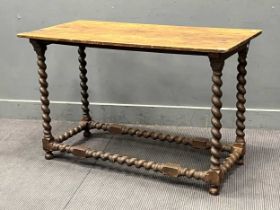 An oak side table, 17th century and later, with turned supports and stretchers 76cm H x 120.5cm W