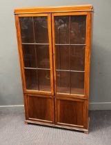 An early 20th century mahogany bookcase with two glazed doors and two panelled doors below, 178cm