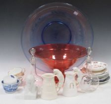 A large red glass stem bowl, a large blue glass bowl, a Copeland cat cream jug, another similar