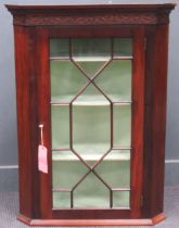 An Edwardian mahogany corner cupboard with blind fret carved detail 102 x 76 x 45cm