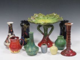 A collection of 19th century and later art pottery to include Bretby, Pilkington etc