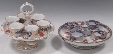 A Spode imari egg cup stand and four cups, with salt cellar, circa 1815; together with a Continental