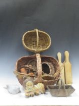 A collection of baskets, antique butter pats, tole watering can etc