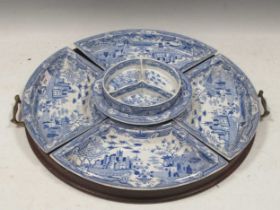 A blue printed earthenware 'Gothic Castle' pattern supper set, circa 1810, comprising four fan
