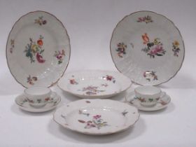 Four 18th century Meissen plates and two Meissen Marcolini period teacups and saucers (8)