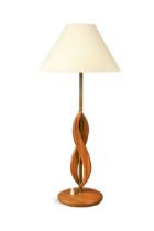 A 1970s teak and brass table lamp,