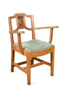 A 1930s pale oak college elbow chair,