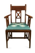 An Aesthetic period mahogany elbow chair,