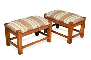 A pair of Cotswold School pale oak footstools, circa 1930,