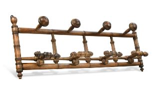 A turned beech pullman style hat and coat rack, circa 1930,