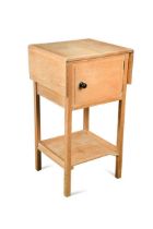 A Heals limed oak drop leaf pot cupboard,