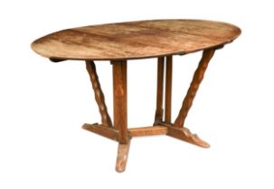 Arthur Romney Green (1872-1945), an Arts & Crafts oak drop-leaf table, circa 1910,