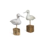 In the style of Guy Taplin, two white-painted model seabirds,