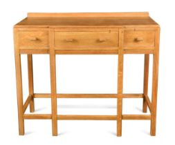 Attributed to Heal's, a Cotswold School pale oak breakfront side table, circa 1930,