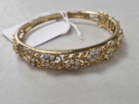 An opal and diamond bangle, hallmarked Birmingham, 9ct gold, weight 21g