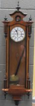 A 19th century walnut Vienna wall clock, single weight movement with seconds dial, 109cm high