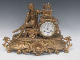 A French gilt metal figural mantel clock circa 1900. Depicting a seated artist with easel and