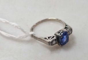 A sapphire and diamond three stone ring, estimated approximate weight of sapphire 1.90ct, unmarked