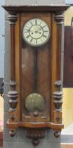 A walnut cased Vienna wall clock