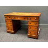 A small late 19th century partner's desk with leather top.