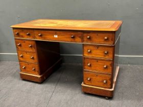 A small late 19th century partner's desk with leather top.