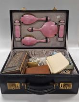 A silver and enamel dressing table set, together with a collection of beads and costume jewellery, a