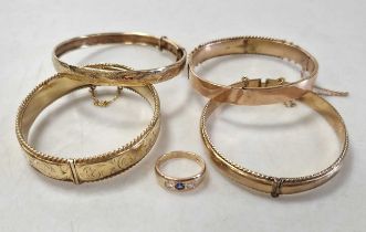 Three 9ct gold bangles and a 9ct gold gem set ring, 32g gross, along with a rolled gold bangle (5)