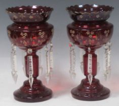 A pair of ruby glass lustres, 28cm high