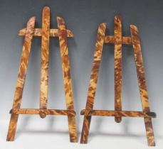 A near pair of faux tortoiseshell table easels (lacking struts)