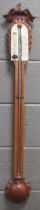 A late 19th century carved oak stick barometer. 103cm