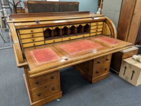 A Victorian mahogany roll top desk, with satinwood fitted interior. 103cm x 152cm x 78cm See images
