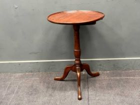 A George III oak tripod table. 71cm x 51cm