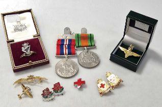 A hallmarked 9ct gold Royal Ulster Rifles badge set with diamonds, and a hallmarked 9ct gold