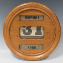 A Victorian day date calendar. 31.5 diam