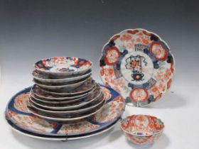 A collection of mostly Japanese Imari plates and chargers. Chargers diameter 46cm largest