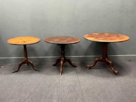 An early 19th century oak tripod table, three plank tilt top on cabriole legs. 69cm x 77cm diam,