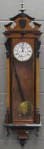 A 19th century walnut Vienna wall clock, twin train movement in part ebonised case, 116cm high