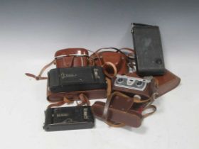 Old cameras. Wray stereographic camera, 2 bellows cameras - Zeiss Ikon and Kodak, 2 other Kodaks,