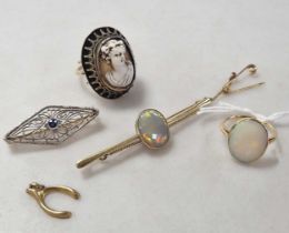 an opal ring tested as 18ct gold weight 2.7g, together with an opal brooch tested as 9ct gold, a
