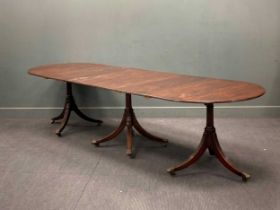 A Regency style mahogany triple pedestal dining table, with two additional leaves, 76 x 306 x